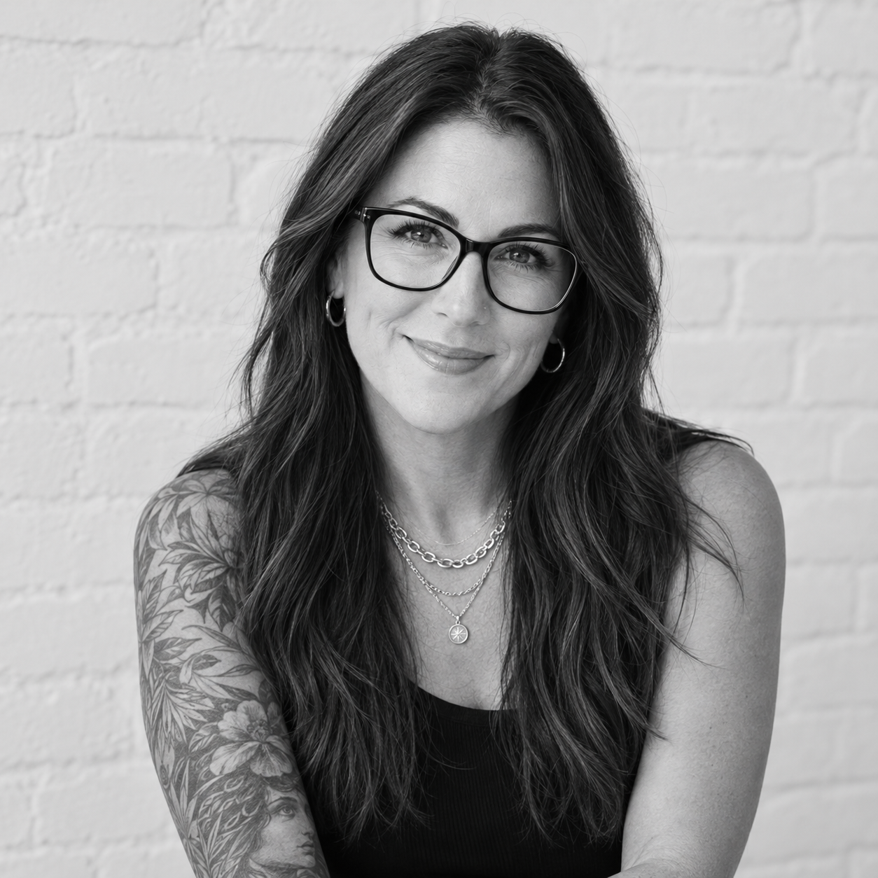 Christine-Farina-PMHNP-BC-smiling-in-a-black-and-white-portrait